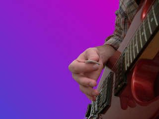 positioning the guitar pick - image 2