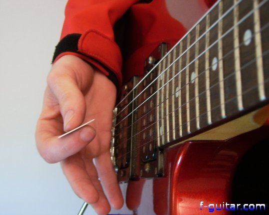 Performing a rake on electric guitar - picking hand